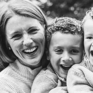Lauren and her two kids smiling before their kids class