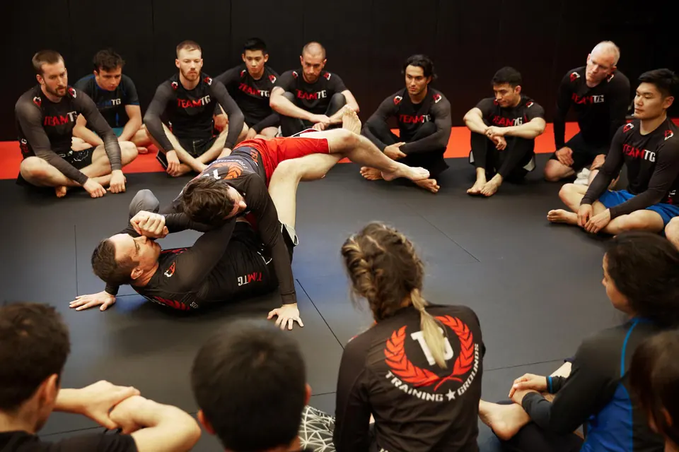class full of people of all ages and genders training mma in nj