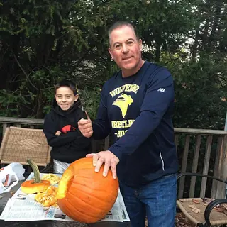 Mike Grey and his son smiling after class